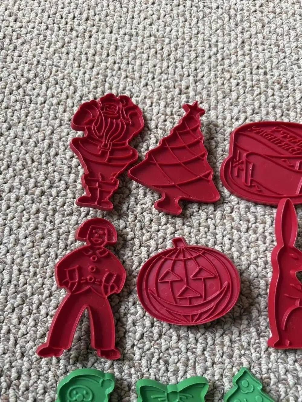 Vintage Christmas cookie cutters with red and green holiday shapes